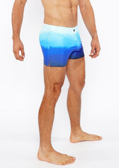 Blue gradient printed swim shorts featuring a smooth seamless design ideal for beach and pool wear