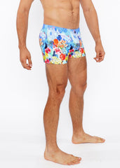 Floral abstract printed swim short featuring vibrant red orange yellow and blue floral patterned swim trunks