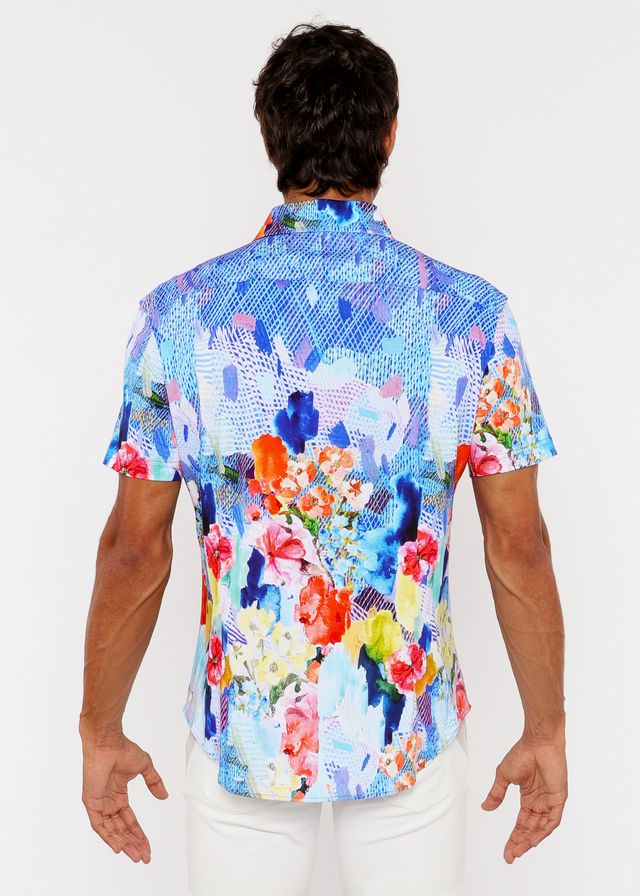 A vibrant short-sleeved woven modal shirt with bold abstract floral pattern in blue pink orange and yellow