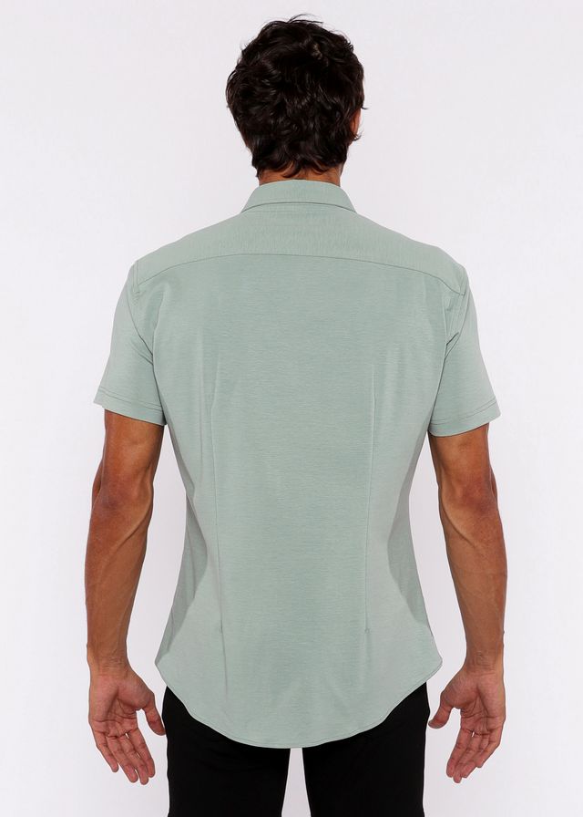 A light green stretch knit shirt for men with short sleeves and tailored fit featuring subtle stitching details