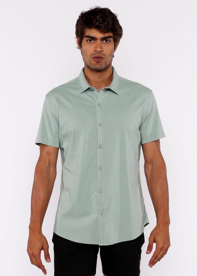 A light green stretch knit shirt with short sleeves classic collar and neatly stitched seams