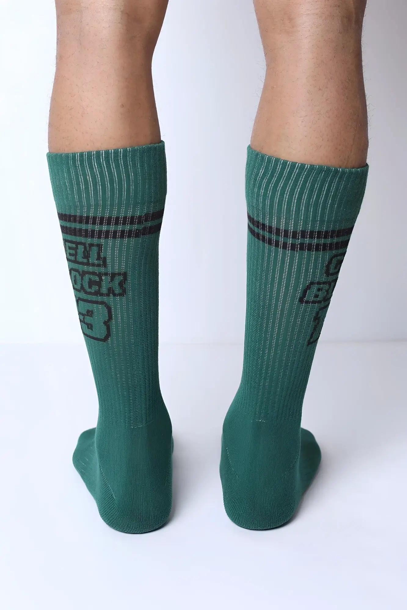 Starter crew socks in green ribbed cotton with dark gray stripes and bold cell rock 3 graphic on the side