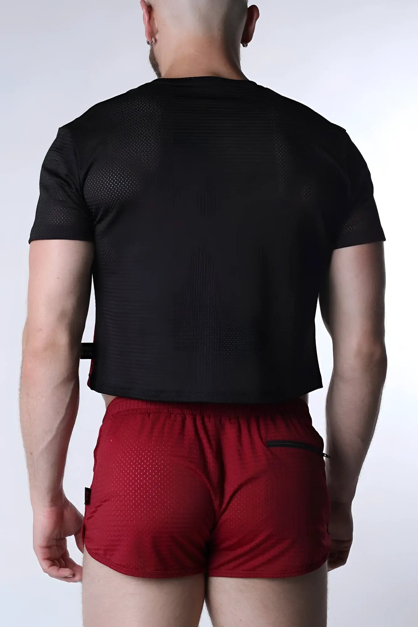 Black mesh short-sleeved crop top with subtle textured pattern perfect for sporty casual wear