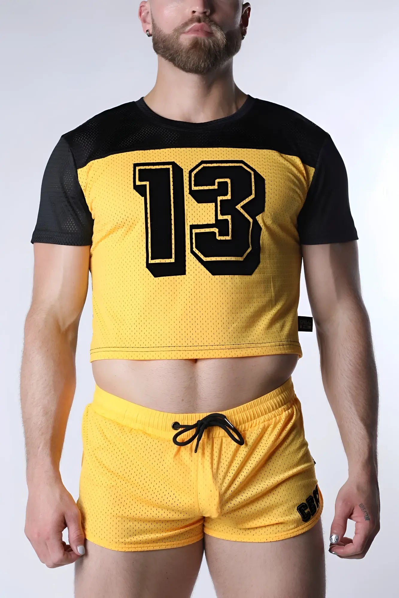 Starter mesh crop top in yellow with black sleeves and a bold 13 number in black outlined in yellow