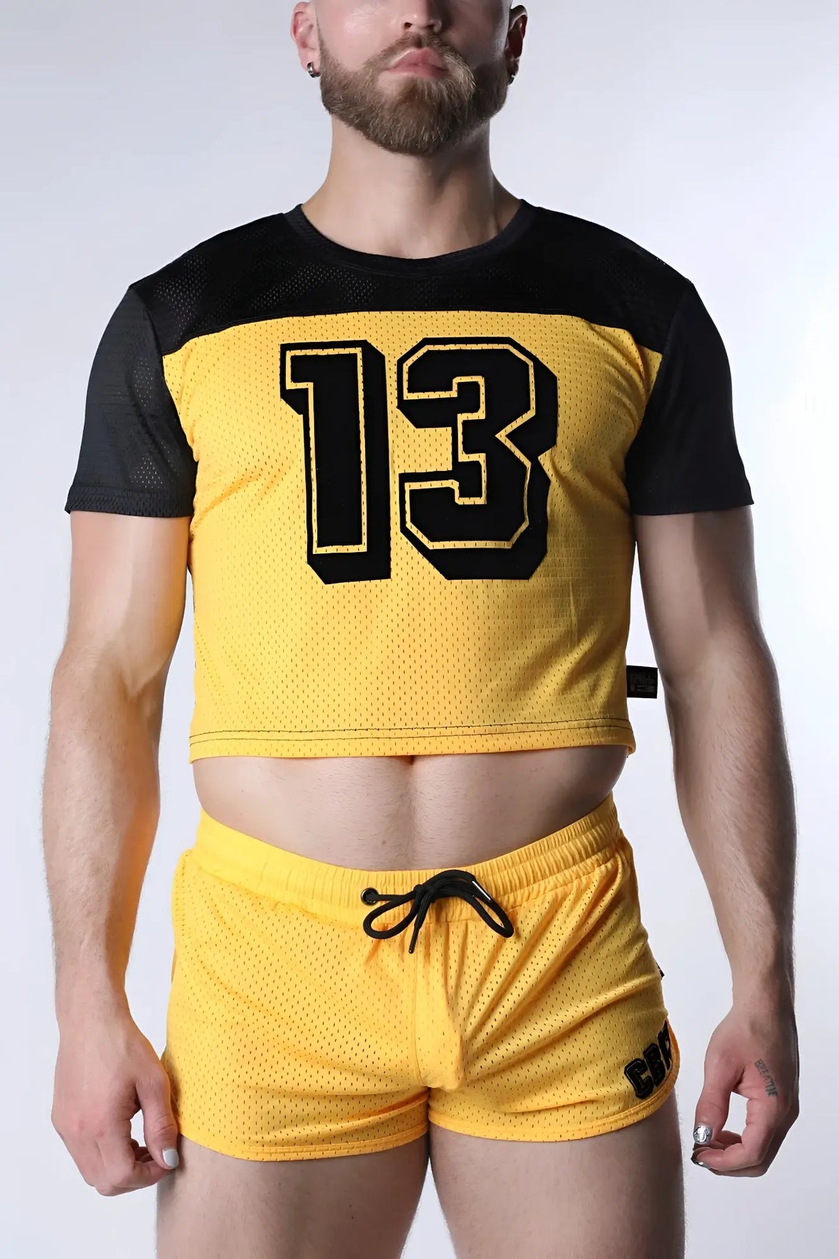 Starter mesh crop top in yellow with black sleeves and a bold 13 number in black outlined in yellow