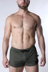 Olive green textured starter mesh shorts with black drawstring and side pocket detail for athletic wear