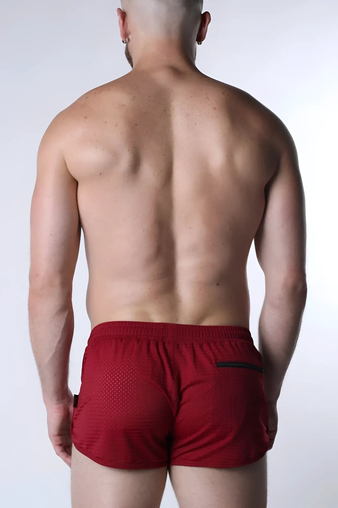 Starter mesh short red athletic shorts with mesh texture and black trim on side pockets