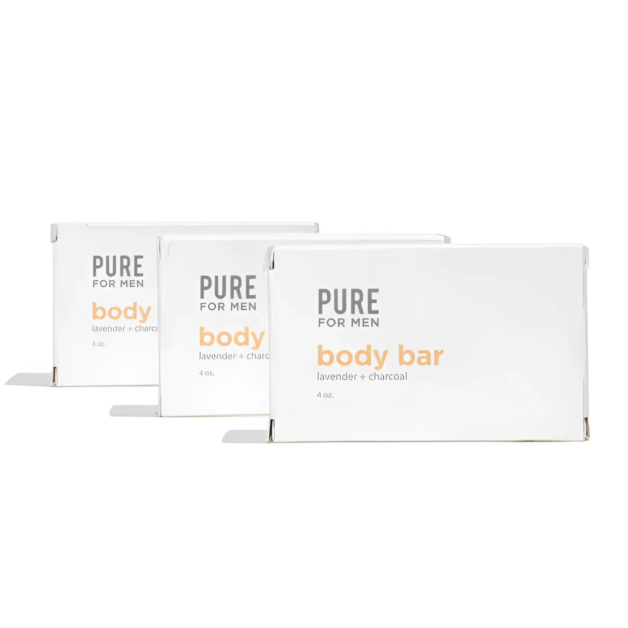 Three white rectangular boxes of pure for men lavender charcoal body bar labeled stay ready bar in orange and gray text