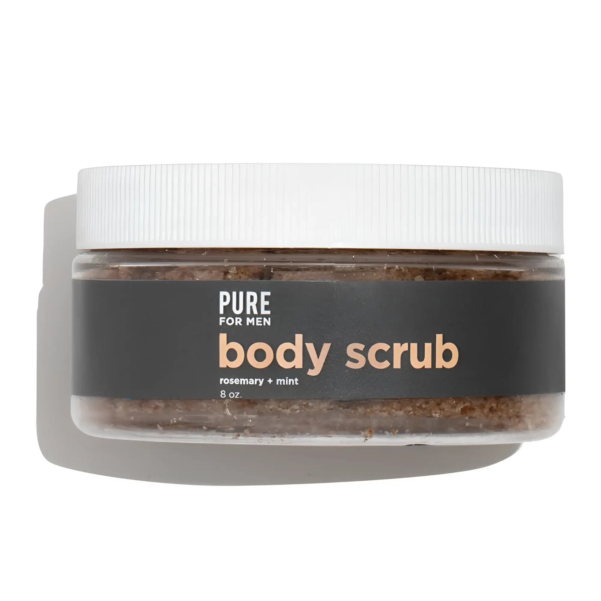 A clear jar with a white lid contains brown granular body scrub labeled pure for men in stay ready scrub product