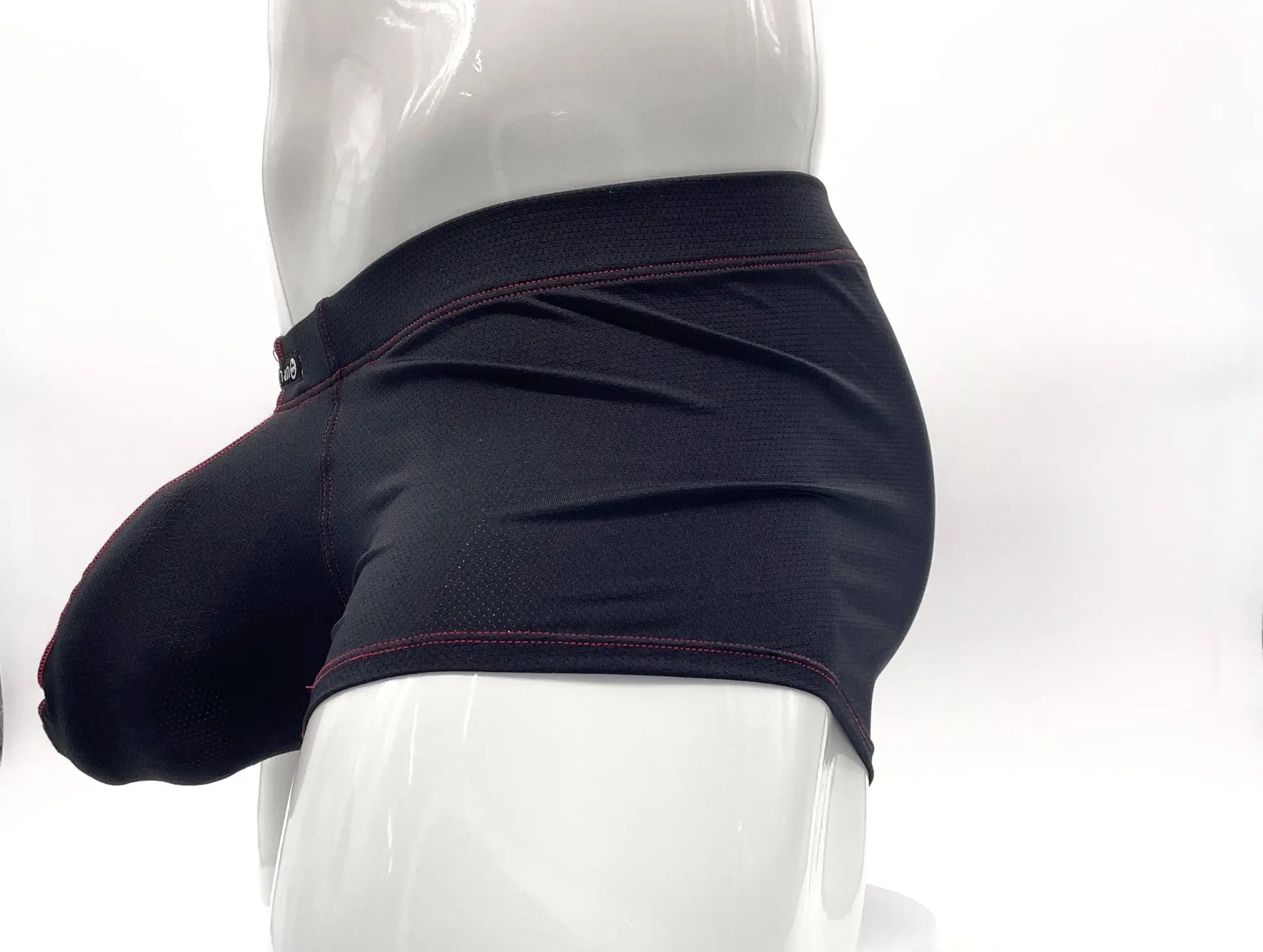 Black athletic stitch big boy pouch boxer brief with subtle textured fabric and dark red waistband stitching