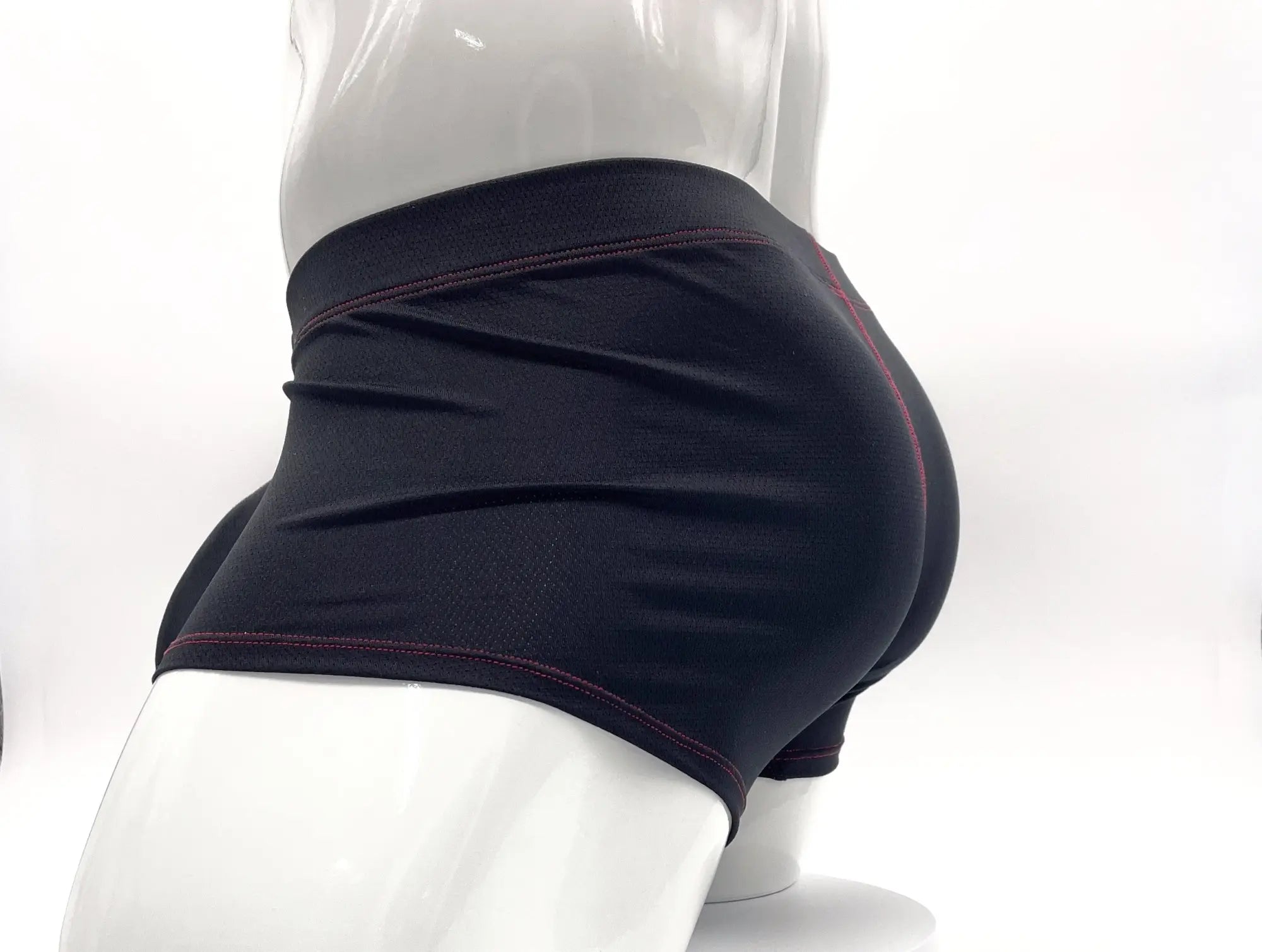 Stitch big boy pouch boxer brief in black high-waisted shorts with subtle red stitching along hem and waistband