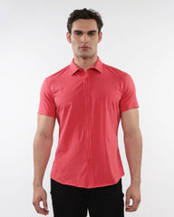 A crisp coral-colored stretch knit shirt with short sleeves and a classic collar featuring neat stitches