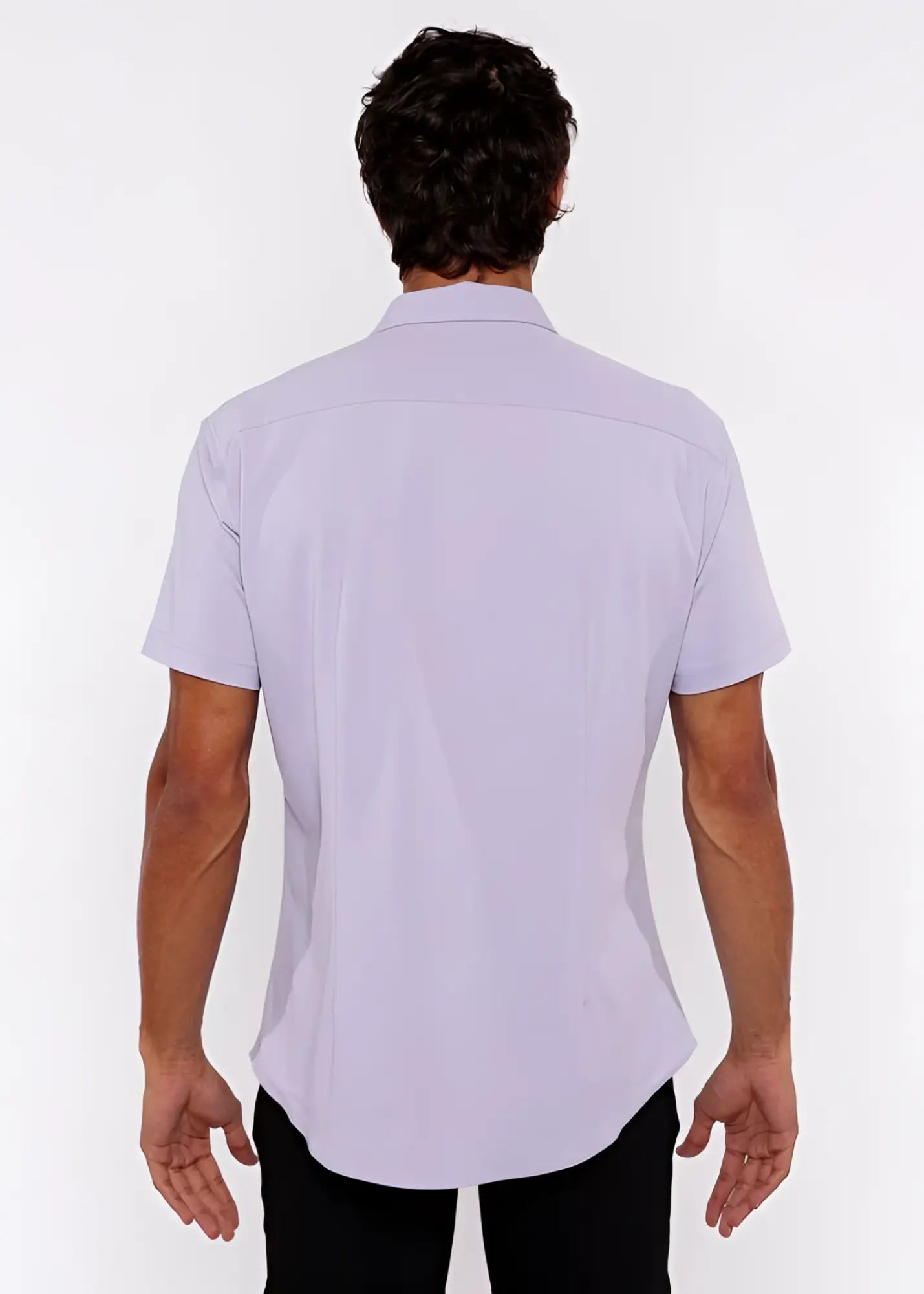 A man wearing a lavender stretch knit short-sleeved shirt with a classic collar and tailored fit