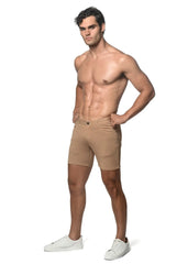 Beige stretch knit athletic shorts with tailored fit and classic five-pocket design for versatile wear