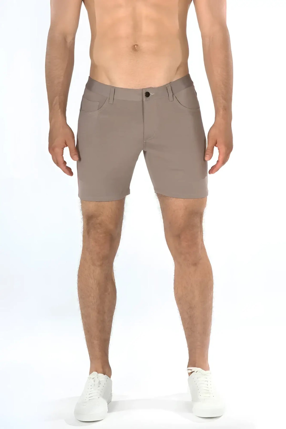 Beige stretch knit shorts with sleek modern design and subtle stitching details for comfortable wear