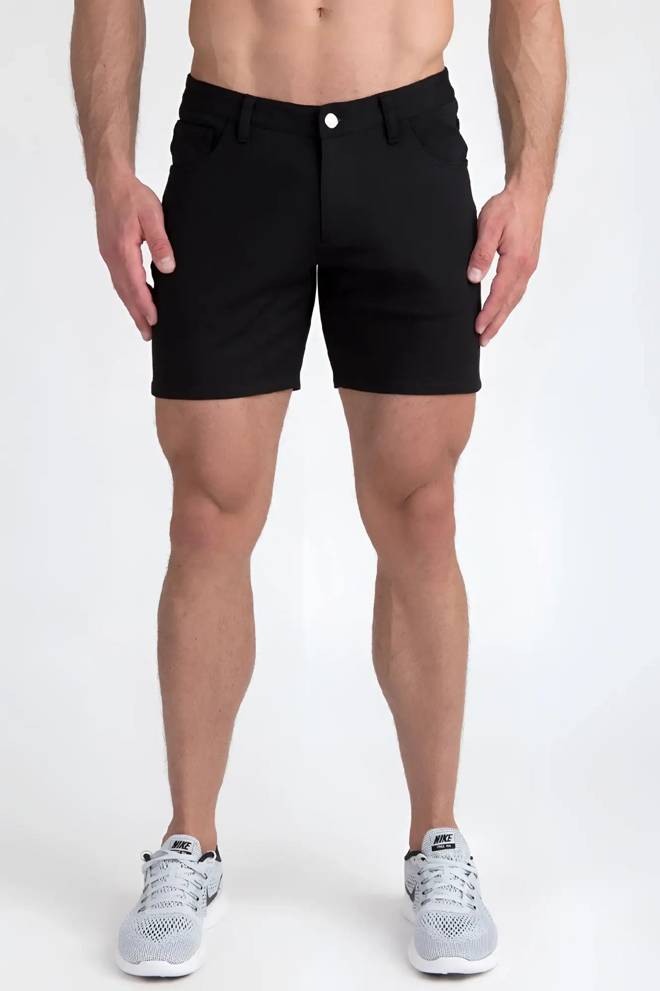 Black stretch knit shorts featuring a classic five-pocket design and single white button closure