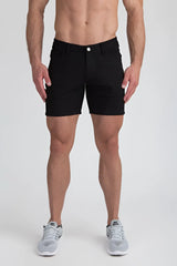 Black stretch knit shorts with classic five-pocket design and white button closure for casual wear