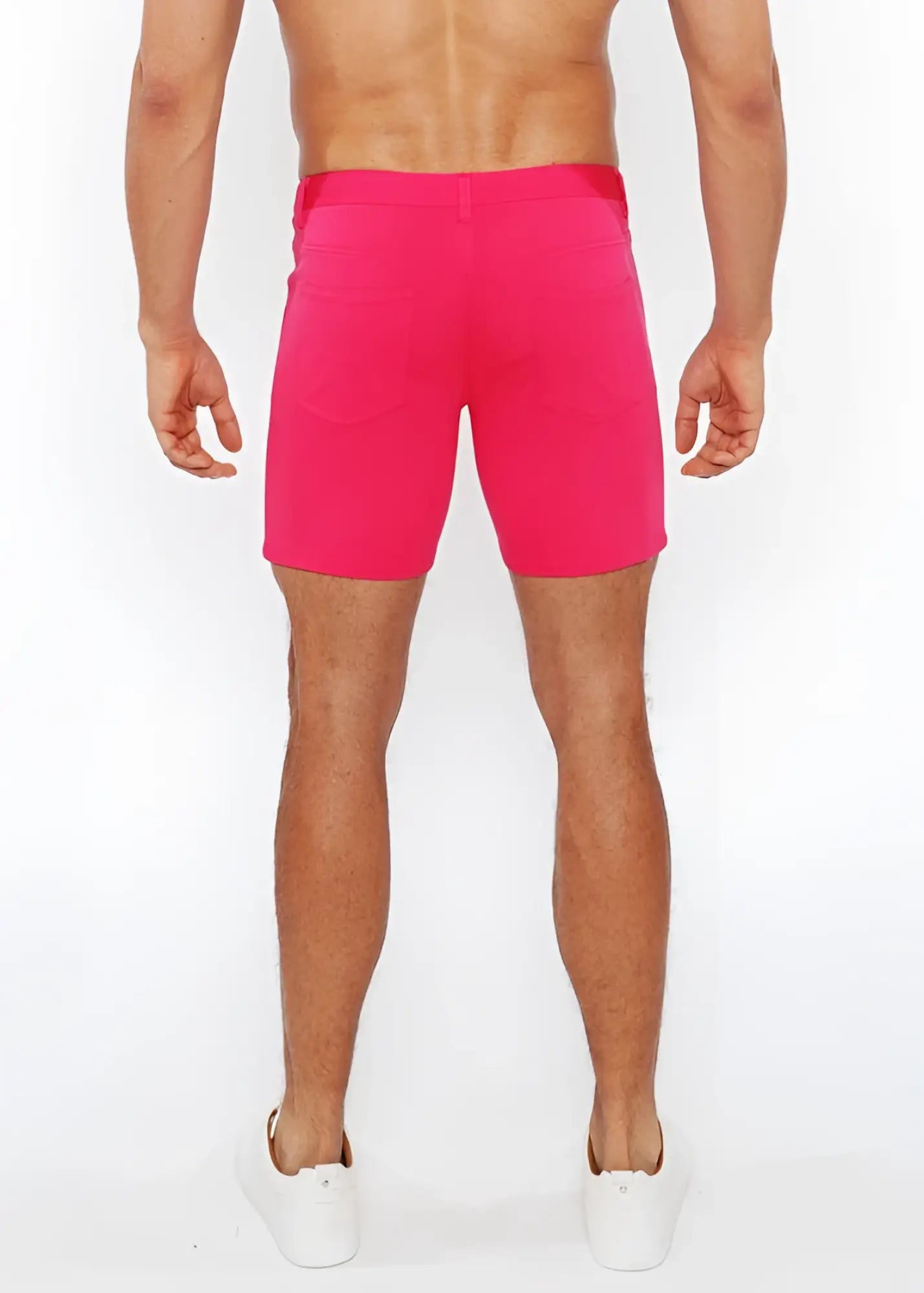 Bright pink stretch knit short with fitted waistband and side pockets for athletic wear