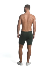 Dark green slim-fit stretch knit shorts made of smooth fabric ideal for comfortable casual wear