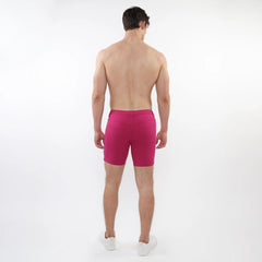 Fuchsia stretch knit short with fitted cut and elastic waistband designed for athletic comfort and flexibility