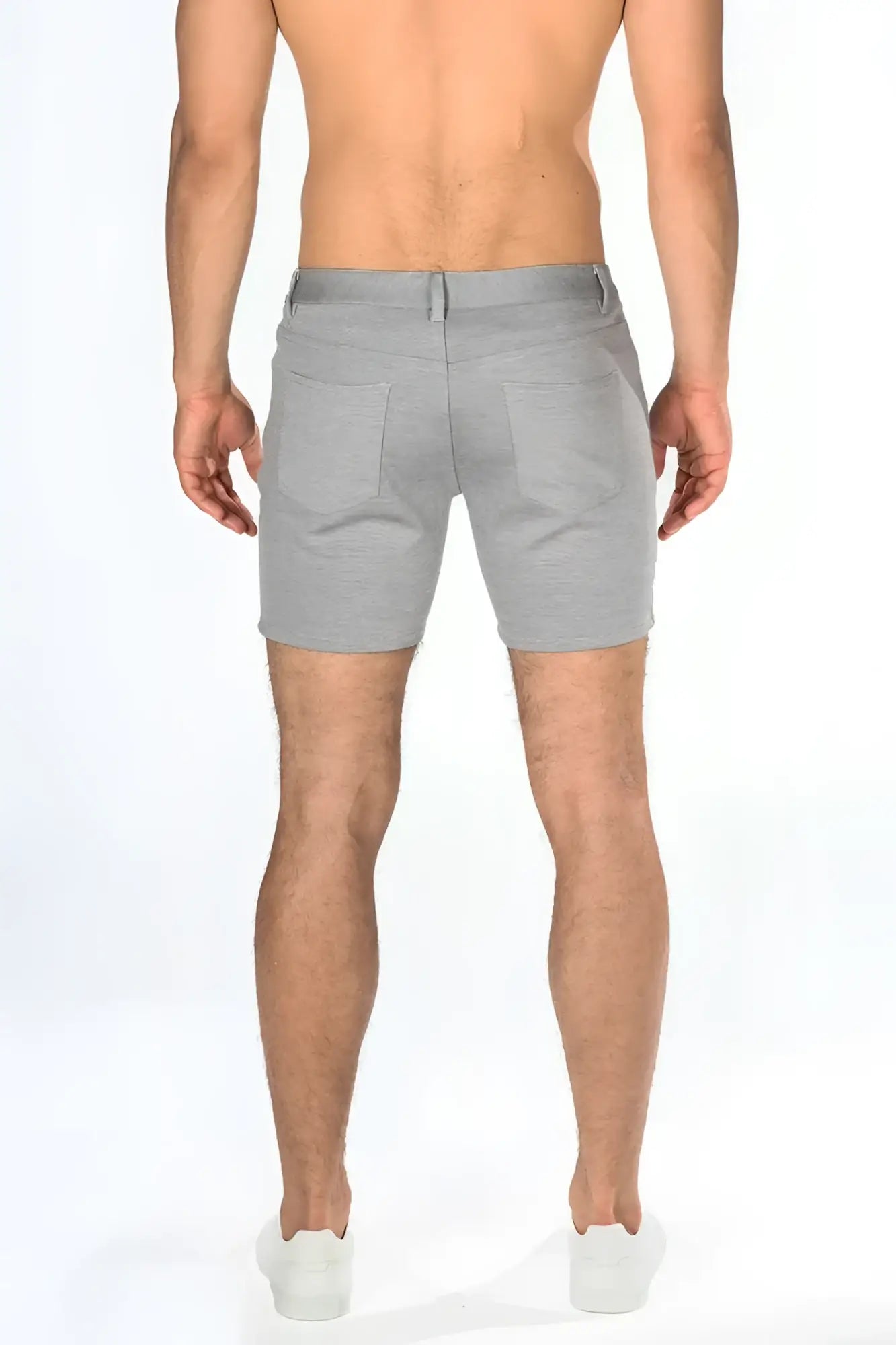 Gray stretch knit shorts with tailored fit and two back pockets shown from the back side