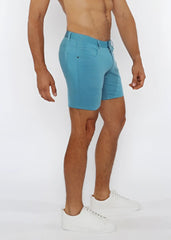 A pair of men’s light blue stretch knit shorts with tailored fit and visible stitching details