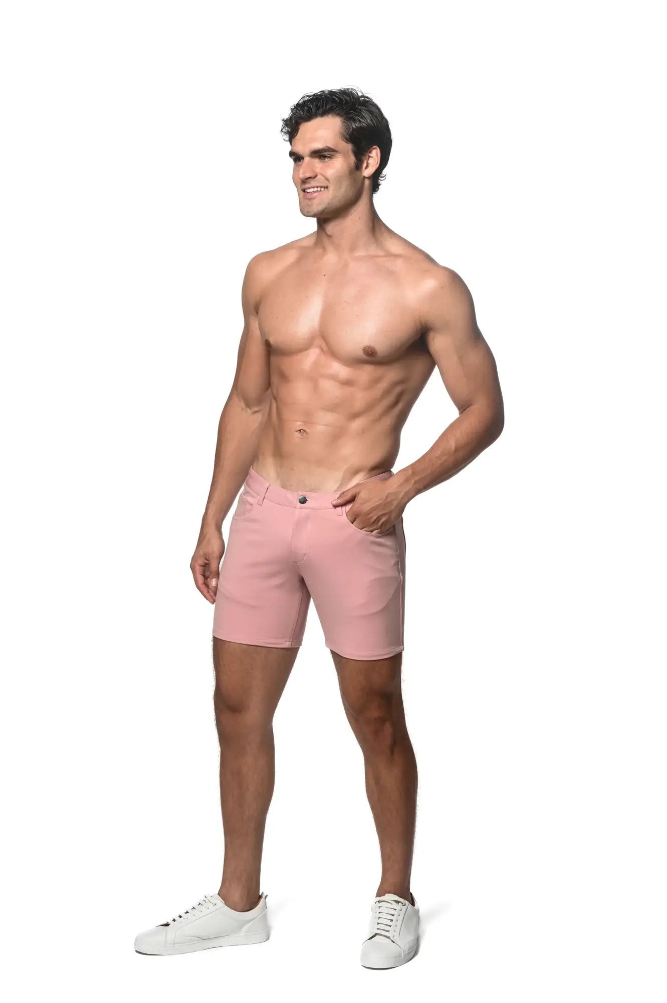 A pair of men’s pink stretch knit chino shorts with classic five-pocket design and button closure