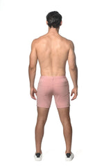 Pink stretch knit shorts with two back pockets and zipper closure shown from the back side