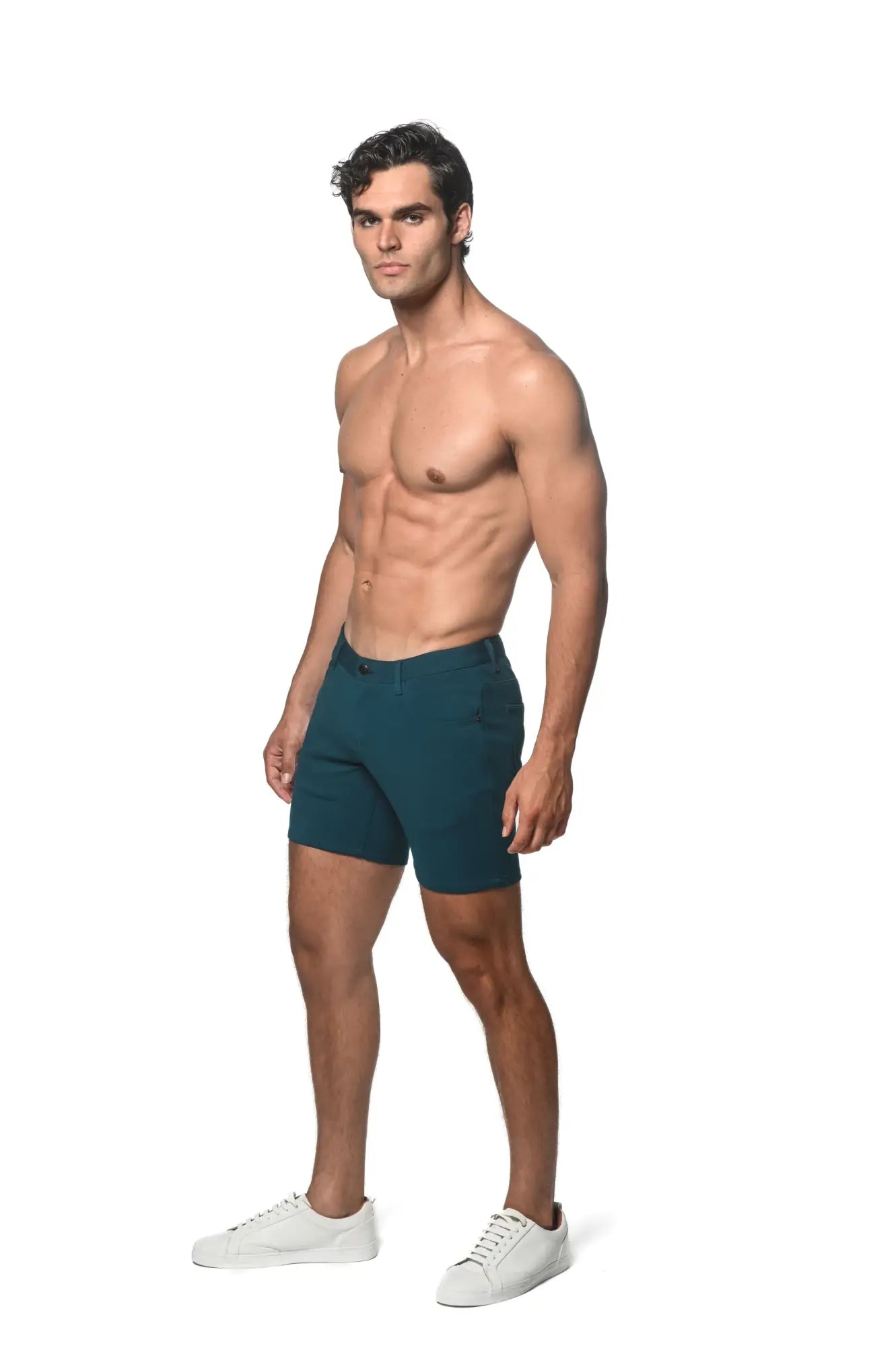 Teal stretch knit short in a tailored design offering a sleek, modern look with flexible fabric for comfort