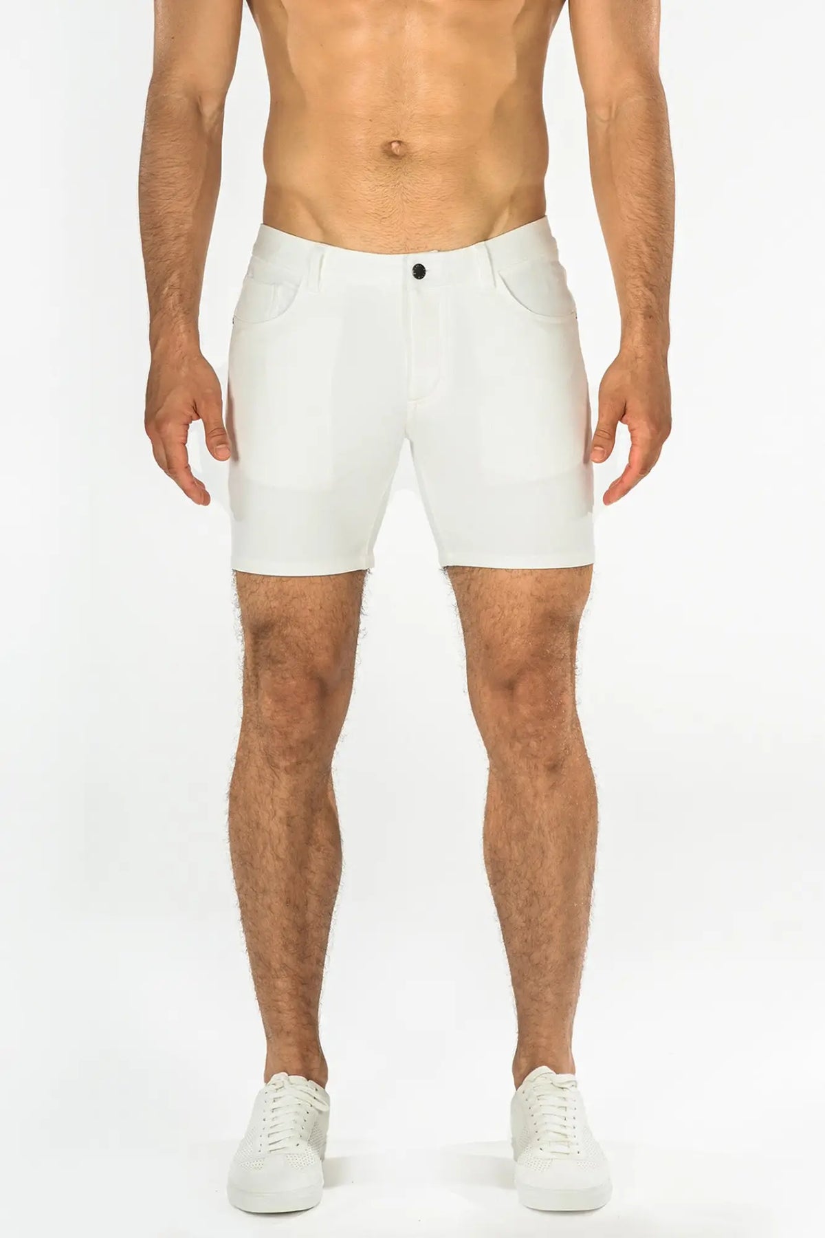 White stretch knit shorts with sleek modern design and subtle stitching details for athletic use
