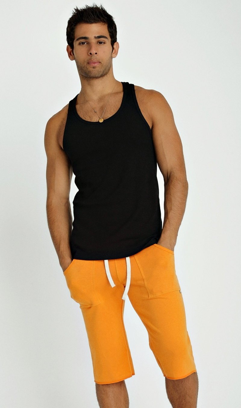 Black sustain tank top with sleeveless design rounded neckline and ribbed hemline perfect for casual wear