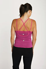 Fuchsia sustain yoga halter sports bra with mesh panel and adjustable crossback straps for support and comfort