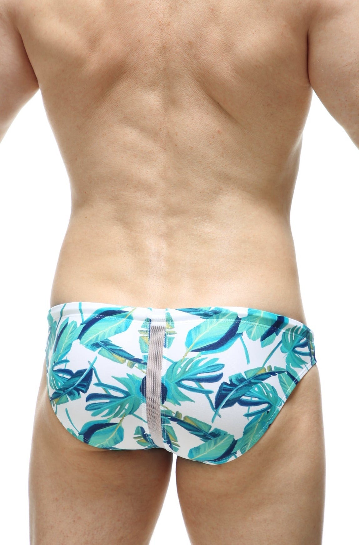White PetitQ swim bikini Tarcu Macouba trunks with vibrant teal and green tropical leaf pattern and central gray zipper