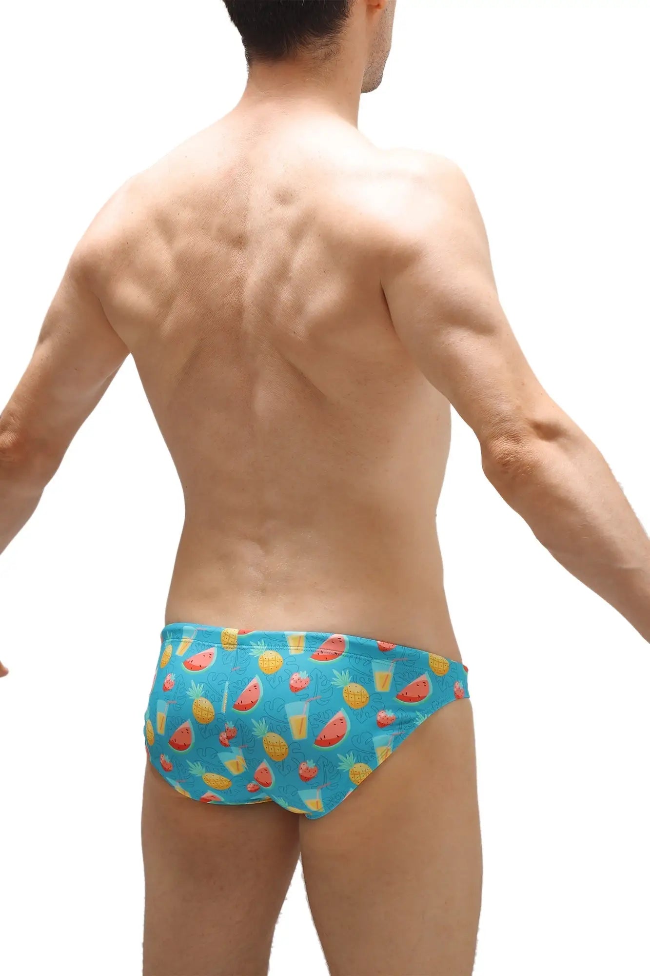 Blue swim bikini taik punta swim trunks with playful watermelon pineapple and tropical drink pattern for beach use