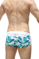 White swim boxer petitq macouba with vibrant teal and green tropical leaf pattern