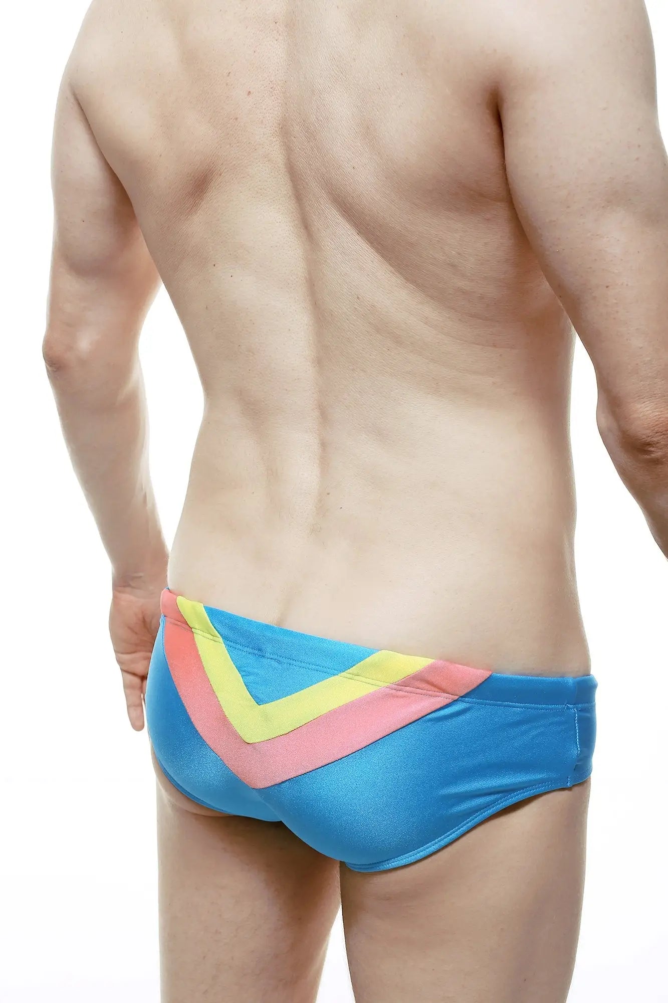 Bright blue swim brief with bold yellow and pink v-shaped chevron pattern ideal for swimming and beachwear