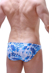 Swim brief pauliat maeha featuring blue and white tropical leaf patterned swim trunks for beachwear