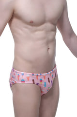 Pink swim brief popsicle featuring a playful pattern of colorful ice cream cones and popsicles for swimwear use