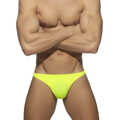 Bright neon yellow swimwear g-string made of smooth stretchy fabric shown from the back side
