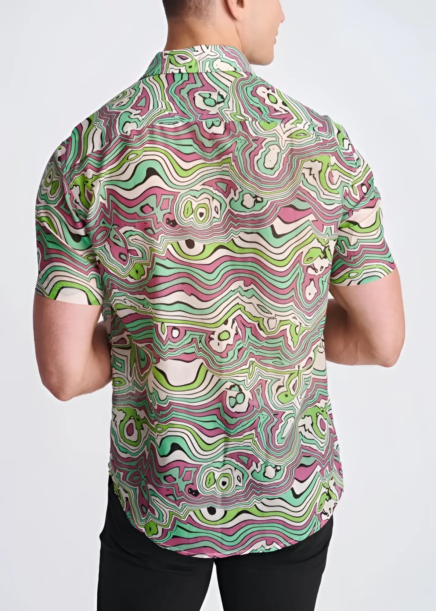 A lightweight cotton silk short-sleeved shirt with a vibrant green pink and white psychedelic swirling pattern