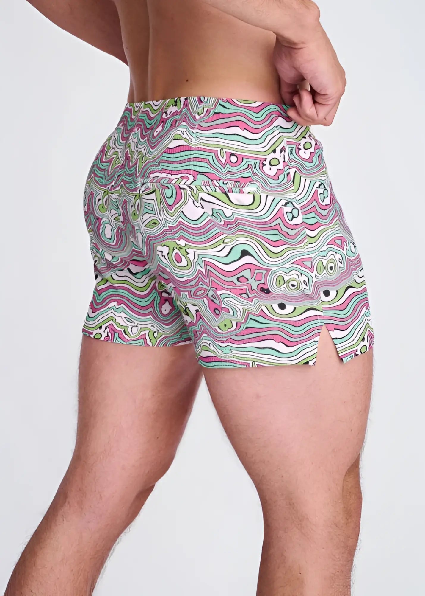Swirls print seersucker swim shorts with mesh lining in vibrant pink green and white psychedelic wavy abstract design
