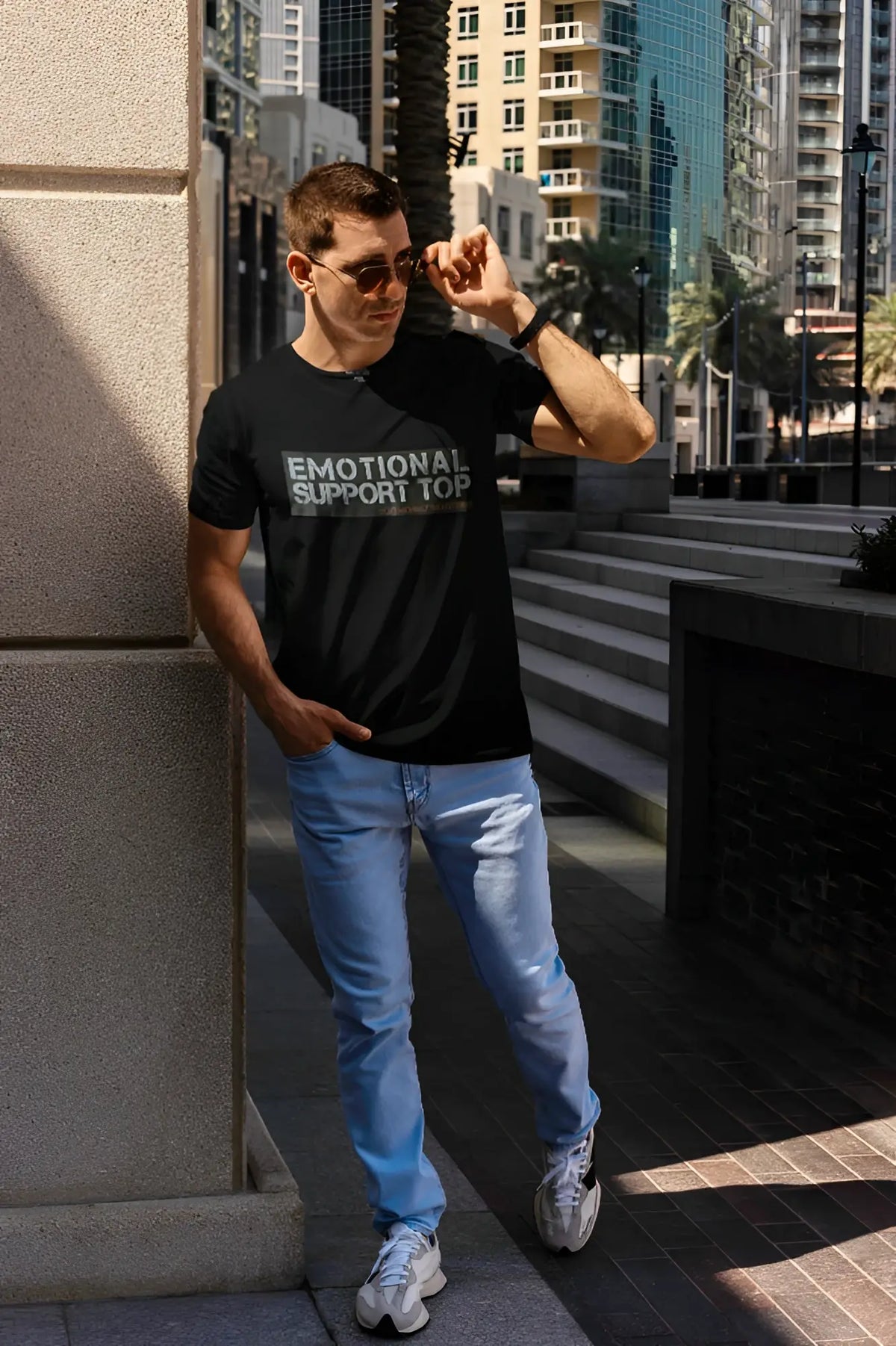 Black short-sleeved cotton t-shirt with emotional support top printed in white and gray on the chest