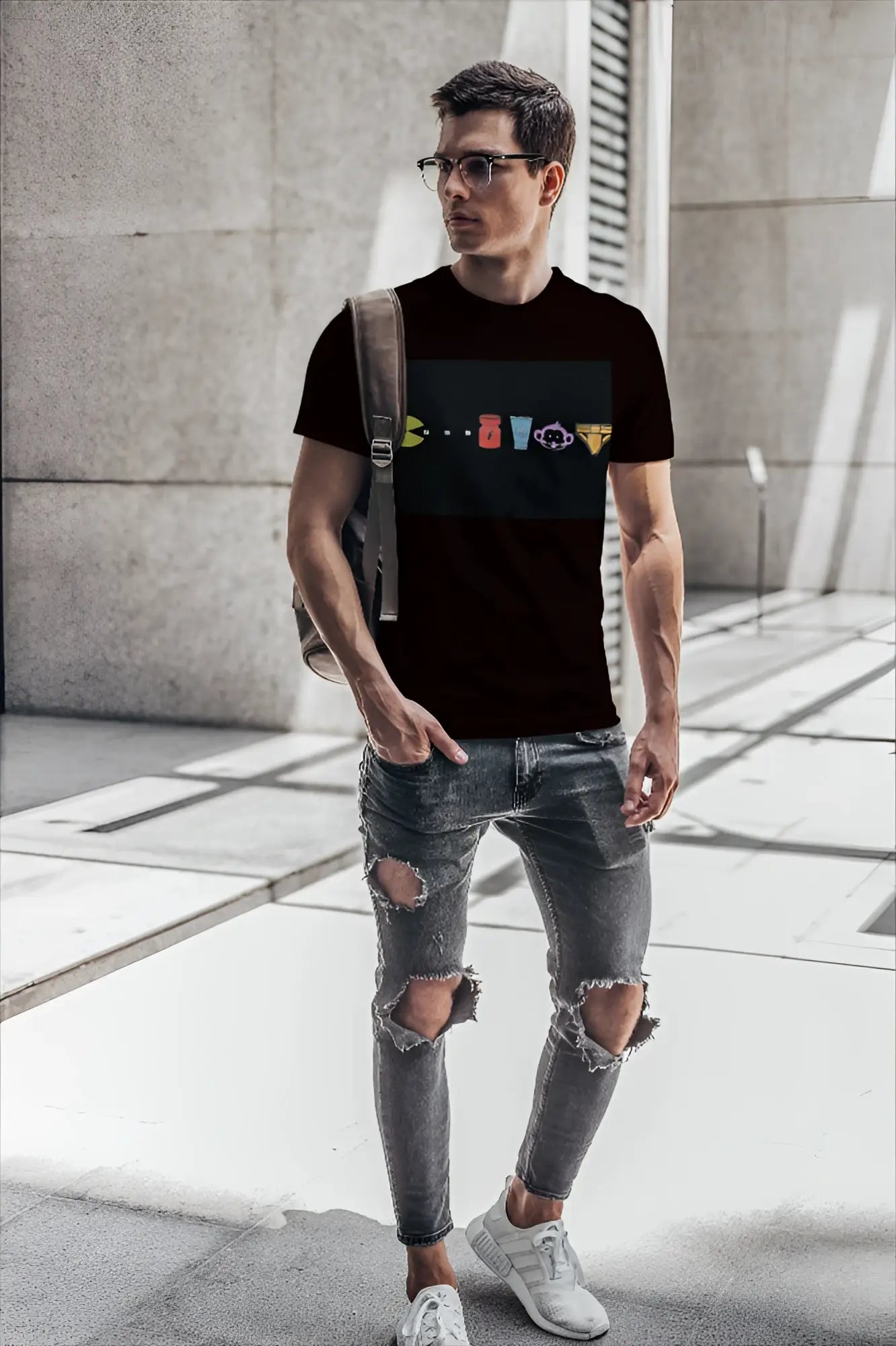 Black short-sleeved cotton t-shirt by t-shirt monkey with colorful classic video game character graphics