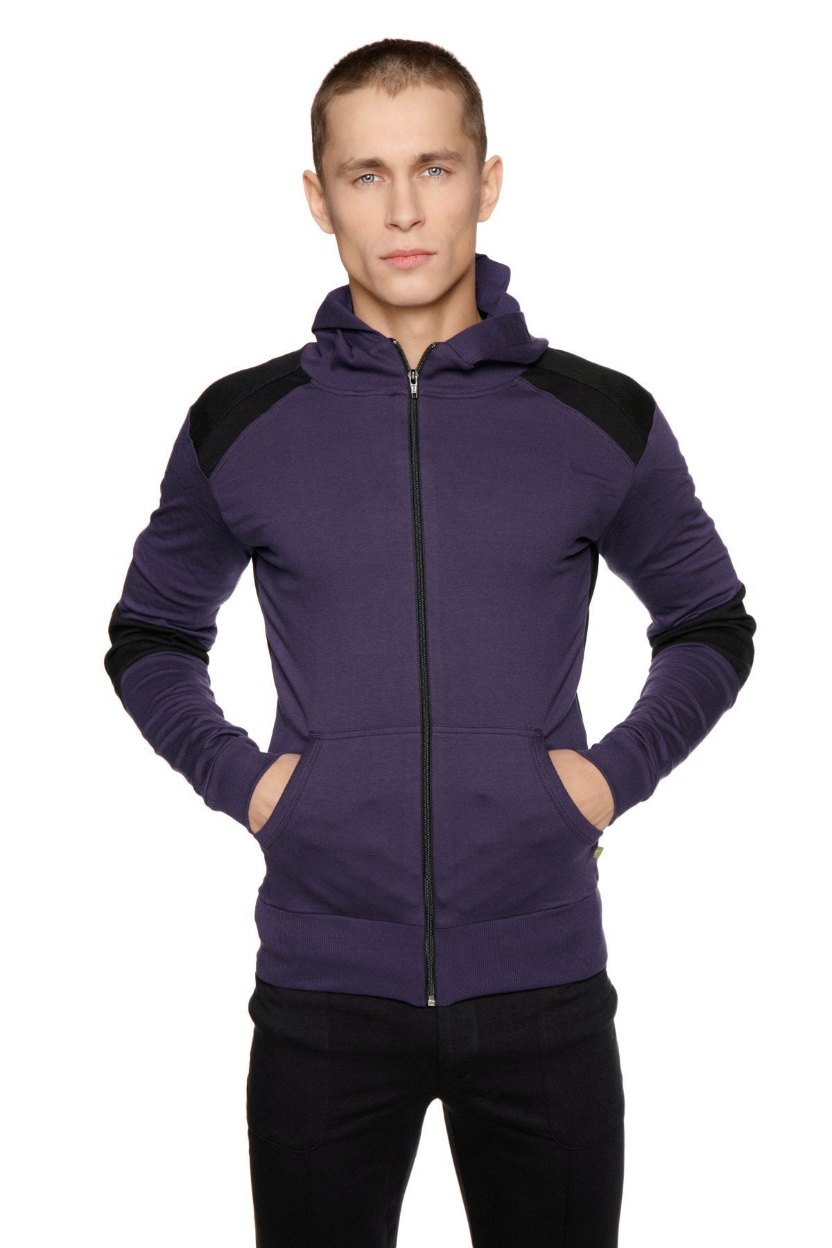 Purple and black zip-up hoodie with contrasting shoulder panels styled with tactical urban at home dress pant yoga pant black