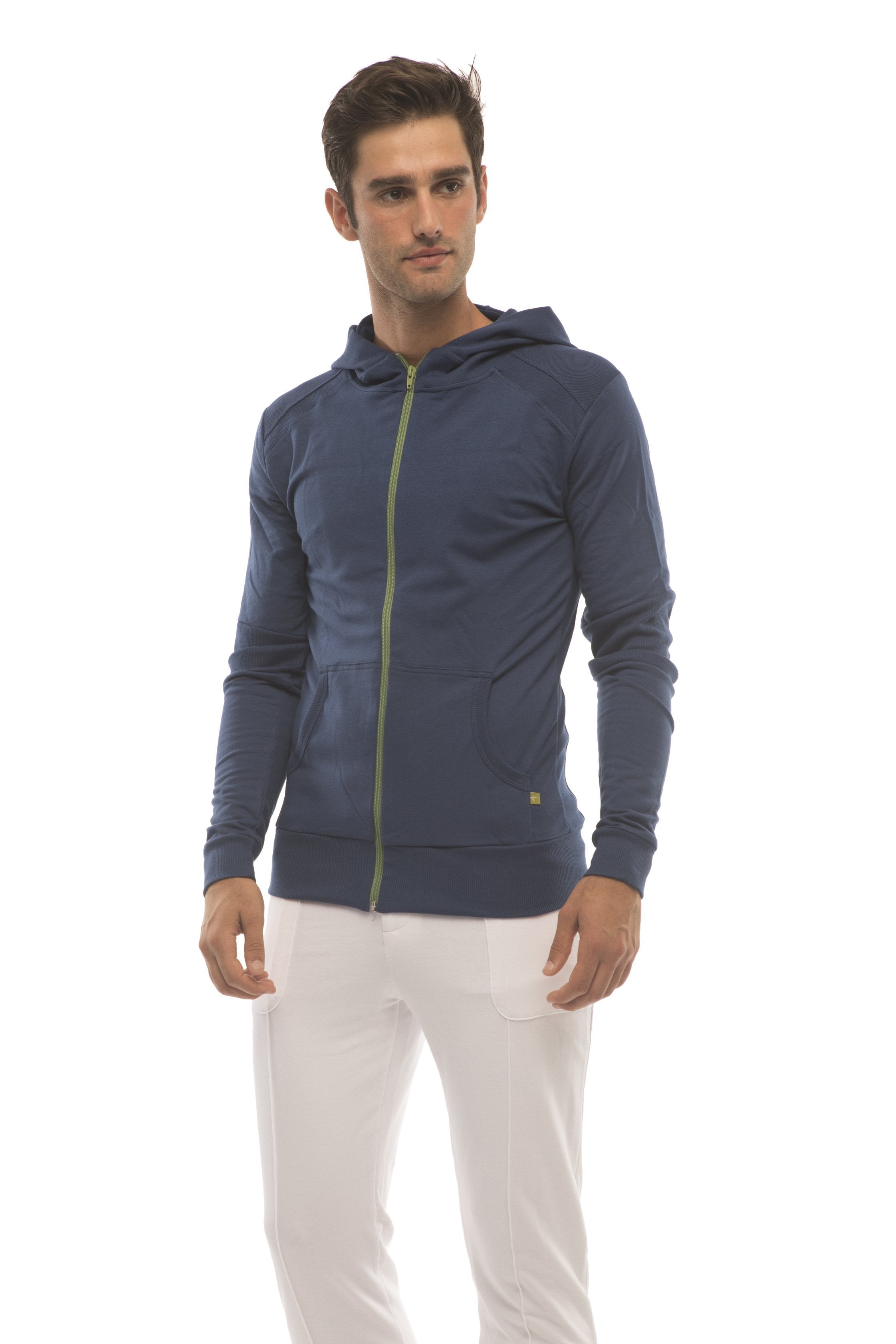 Navy blue zip-up hoodie with lime green zipper and subtle logo on sleeve paired with white tactical urban yoga pants