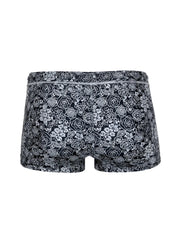 Black tartarus swim trunk briefs with intricate white floral pattern on fabric for stylish swimwear use