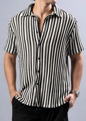 Black and white vertically striped texture knit short-sleeved button-up shirt with a textured pattern