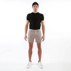 Beige textured jacquard stretch chino shorts with subtle black dot pattern button fly and belt loops