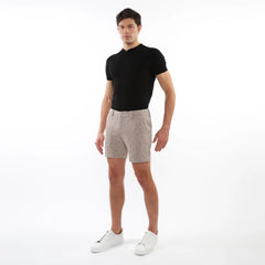 Beige textured jacquard stretch chino shorts with a subtle dark dot pattern made from lightweight fabric