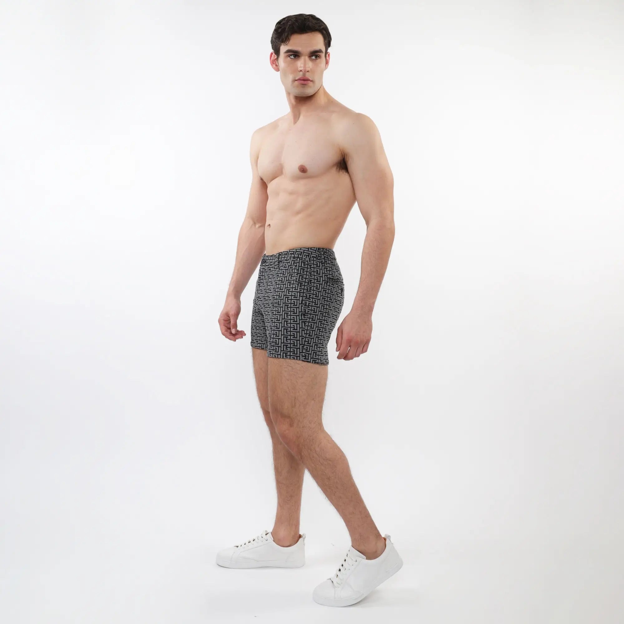 Black and white geometric patterned men’s boxer briefs made from textured jacquard stretch knit fabric